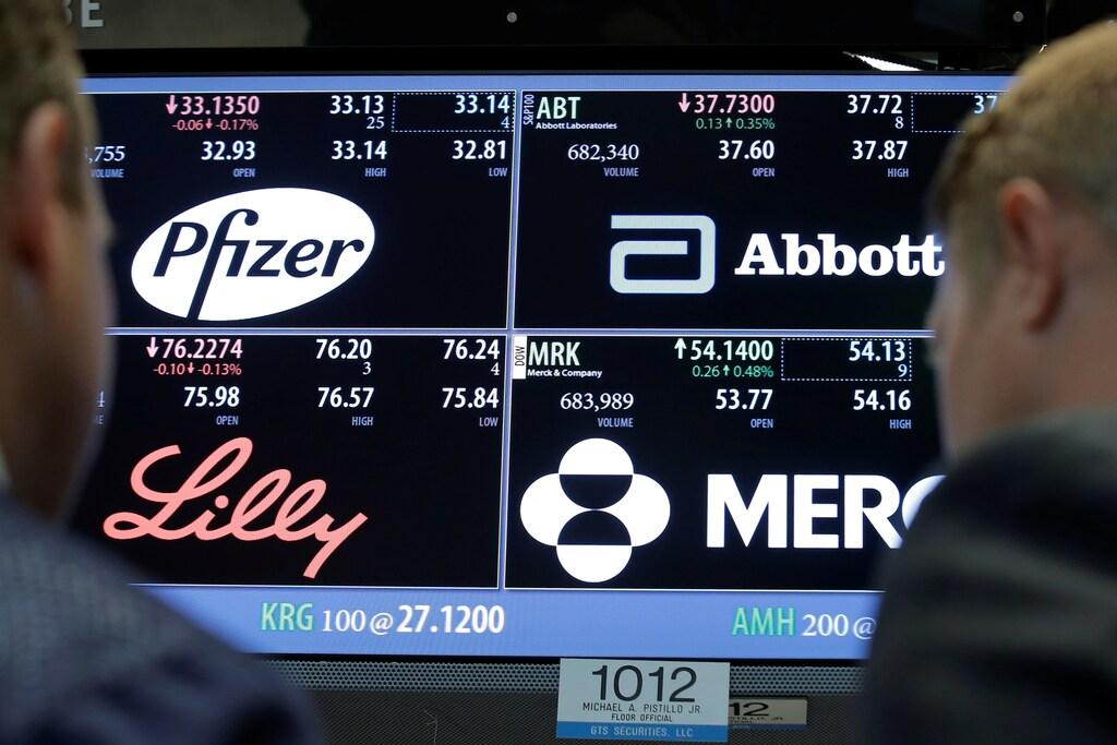 A screen displays trading information for stocks; Pfizer, Abbott Laboratories, Merck and Company and Eli Lilly and Company on the floor of the New York Stock Exchange (NYSE) in New York City, U.S., May 16, 2016. REUTERS/Brendan McDermid/File Photo - RTSVG7C
