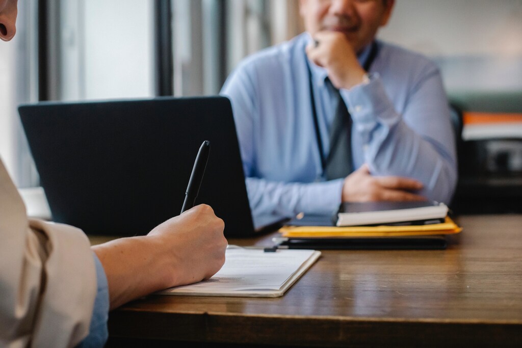 An employee sitting in a performance review with a boss
