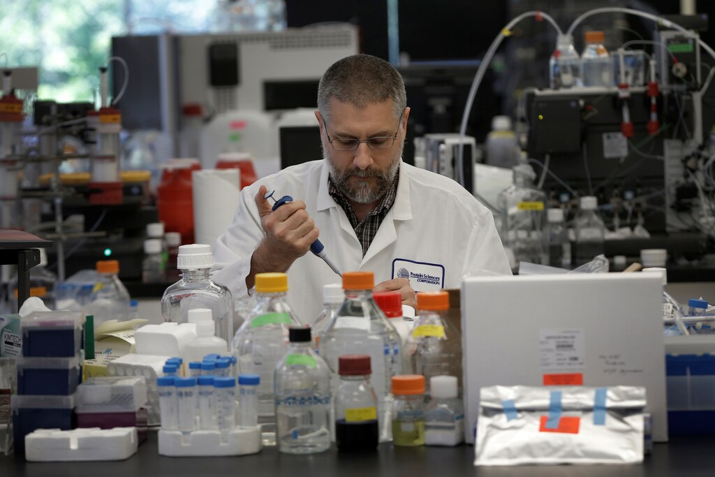 Research scientist Dan Galperin works on Purified Recombinant Zika Enveloped Protein in his laboratory where they are working on developing a vaccine for the Zika virus based on production of recombinant variations of the E protein from the Zika virus at the Protein Sciences Inc. headquarters in Meriden, Connecticut, U.S., June 20, 2016. Picture taken June 20, 2016. REUTERS/Mike Segar - S1BEUEYZHBAB