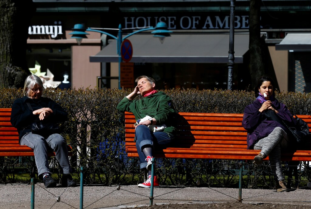 People enjoy a sunnny day at the Esplanade in Helsinki, Finland, May 3, 2017. Picture taken May 3, 2017. REUTERS/Ints Kalnins - RC1837D56E00