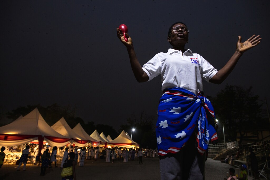A woman prays at an all-female Christian gathering in Kumasi, Ghana January 6, 2017. Ghana's biggest Christian women's group "Women's Aglow" gathered at a university square for an all-night prayer session. REUTERS/Francis Kokoroko SEARCH "FAITH KOKOROKO" FOR THIS STORY. SEARCH "WIDER IMAGE" FOR ALL STORIES.? - RC1A09619A70