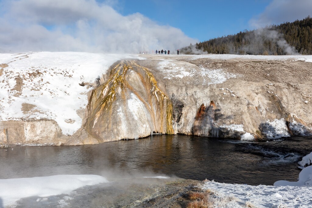 A tour group is seen on Geyser Hill Boardwalks at Yellowstone National Park in Wyoming, U.S., January 28, 2019.