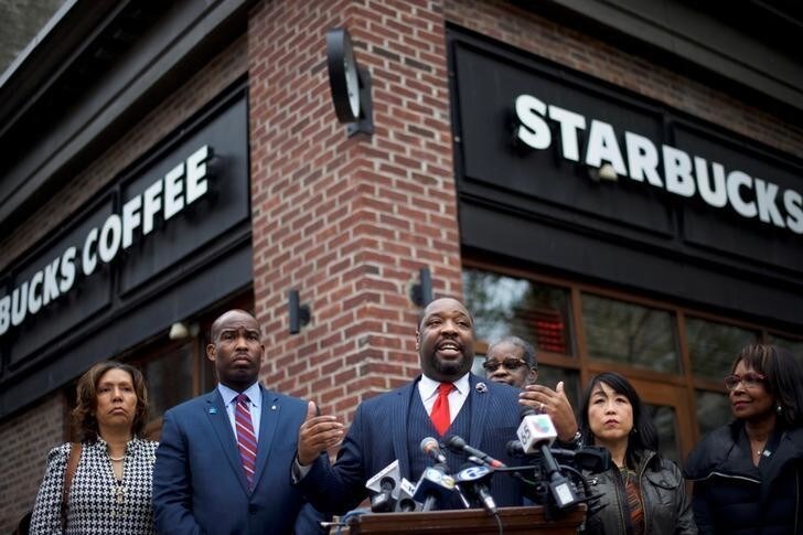 Philadelphia Councilman Kenyatta Johnson (C) addresses the media along with colleagues, outside the Center City Starbucks, where two black men were arrested, in Philadelphia, Pennsylvania U.S. April 16, 2018.REUTERS/Mark Makela