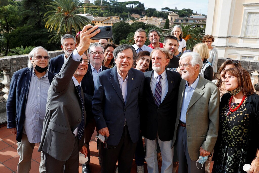 Joint winner of the Nobel Prize for Physics, Italian scientist Giorgio Parisi takes a selfie with his colleagues after the announcement in Rome, Italy, October 5, 2021.