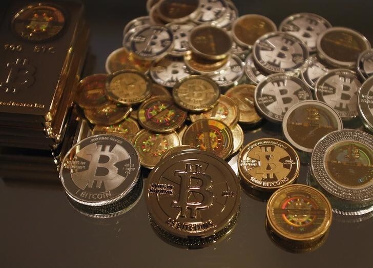 Some of Bitcoin enthusiast Mike Caldwell's coins are pictured at his office in Sandy, Utah, September 17, 2013.Caldwell produces physical coins Bitcoins, which have been around since 2008, and have become a form of electronic money that can be exchanged without using traditional banking or money transfer systems. Bitcoins, touted by some experts as the future of money, gained in prominence during Europe's financial crisis as more people questioned the safety of holding their cash in the bank. REUTERS/Jim Urquhart (UNITED STATES - Tags: BUSINESS SOCIETY)