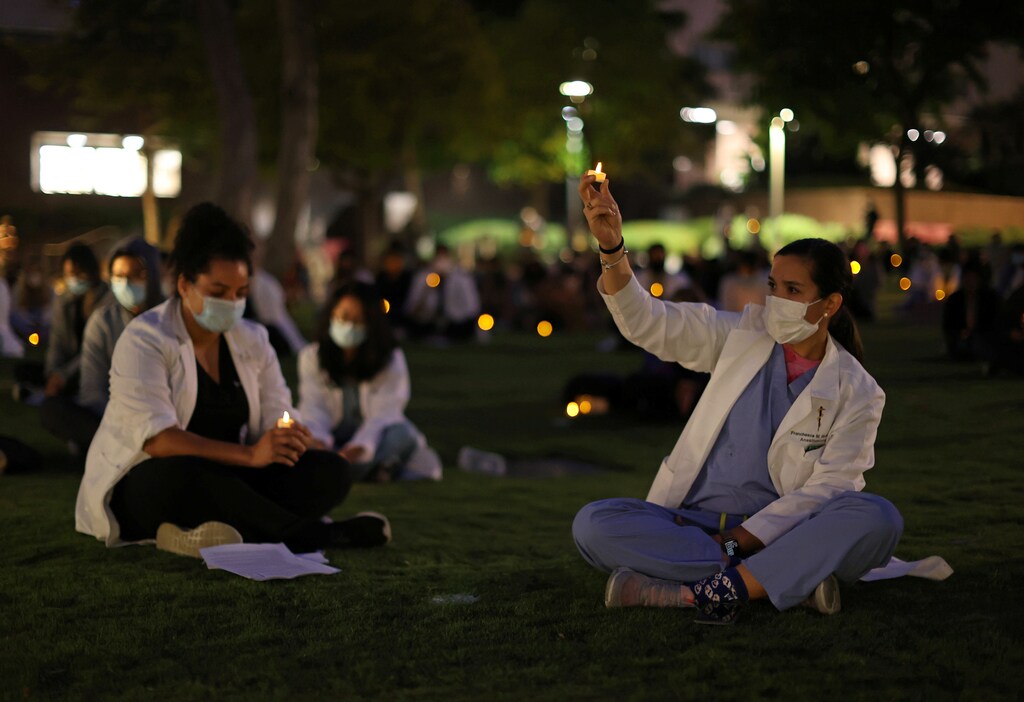 Healthcare workers attend a vigil against systemic racism and police brutality, amid the coronavirus disease (COVID-19) outbreak, in Los Angeles, California, U.S. June 15, 2020. REUTERS/Lucy Nicholson - RC24AH9C6PSO