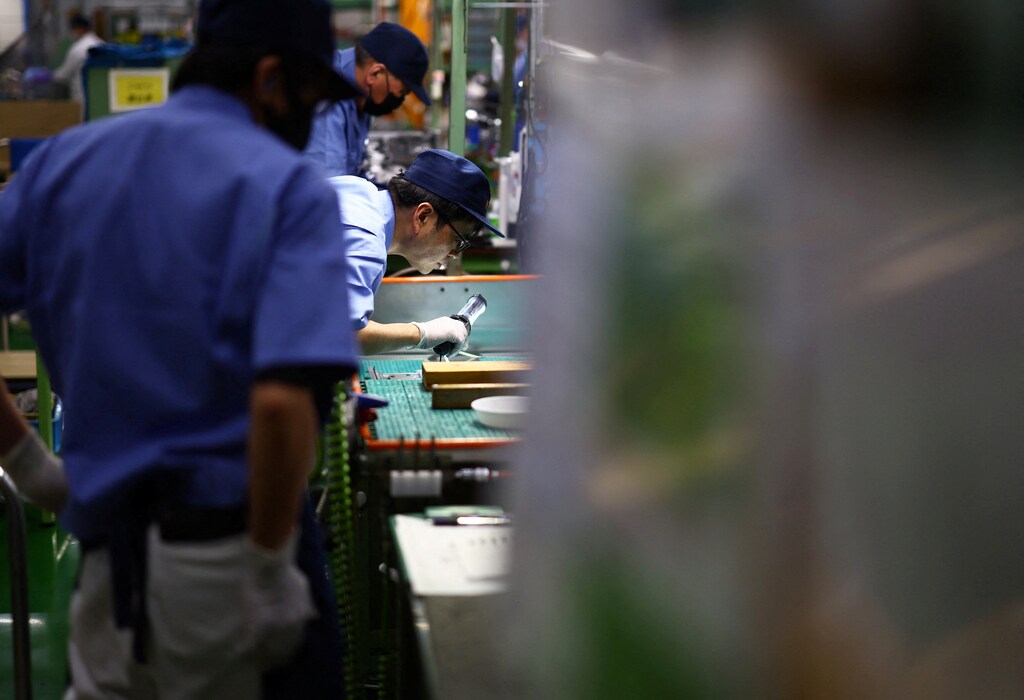 Staff works inside a factory at Kyowa Industrial Co. in Takasaki, Gunma Prefecture, Japan April 11, 2025. REUTERS/Issei Kato