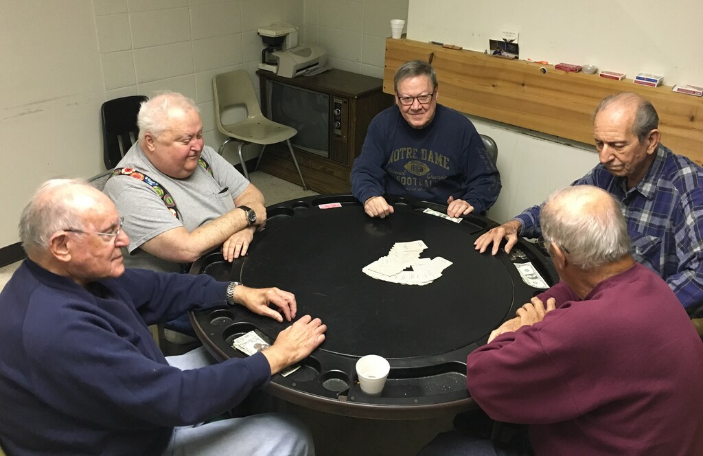 Retired steel workers Mike Pron (L to R) Jim McAndrew, Charlie Kelly, Joe Gonda and Ken Rayden play poker in a union hall in Bethlehem Pennsylvania, U.S., November 9, 2016. Among the five retirees, all life-long Democrats, only three cast ballots for Clinton in a county which voted Democratic in the past two election cycles but backed Republican Donald Trump in this year's presidential race. REUTERS/Peter Eisler - RTX2T3BL