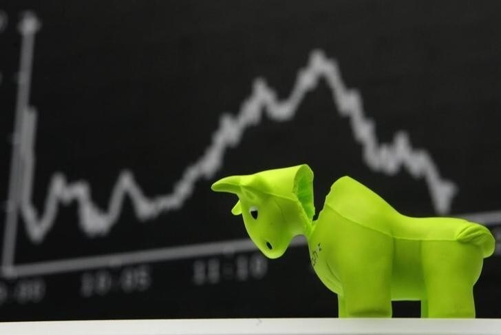 A bull styrofoam figure is pictured in front of the DAX board at the Frankfurt stock exchange September 16, 2008. REUTERS/Alex Grimm (GERMANY)