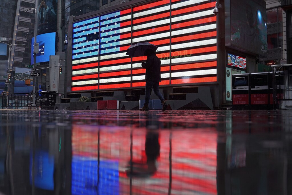 A lone man walks in the rain in a mostly deserted Times Square following the outbreak of Coronavirus disease (COVID-19), in the Manhattan borough of New York City, New York, U.S. Coronavirus china virus health healthcare who world health organization disease deaths pandemic epidemic worries concerns Health virus contagious contagion viruses diseases disease lab laboratory doctor health dr nurse medical medicine drugs vaccines vaccinations inoculations technology testing test medicinal biotechnology biotech biology chemistry physics microscope research influenza flu cold common cold bug risk symptomes respiratory china iran italy europe asia america south america north washing hands wash hands coughs sneezes spread spreading precaution precautions health warning covid 19 cov SARS 2019ncov wuhan sarscow wuhanpneumonia pneumonia outbreak patients unhealthy fatality mortality elderly old elder age serious death deathly deadly
