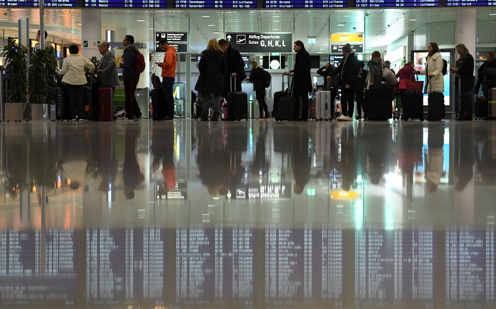 Passengers queue at Munich Airport, Germany, January 5, 2019.