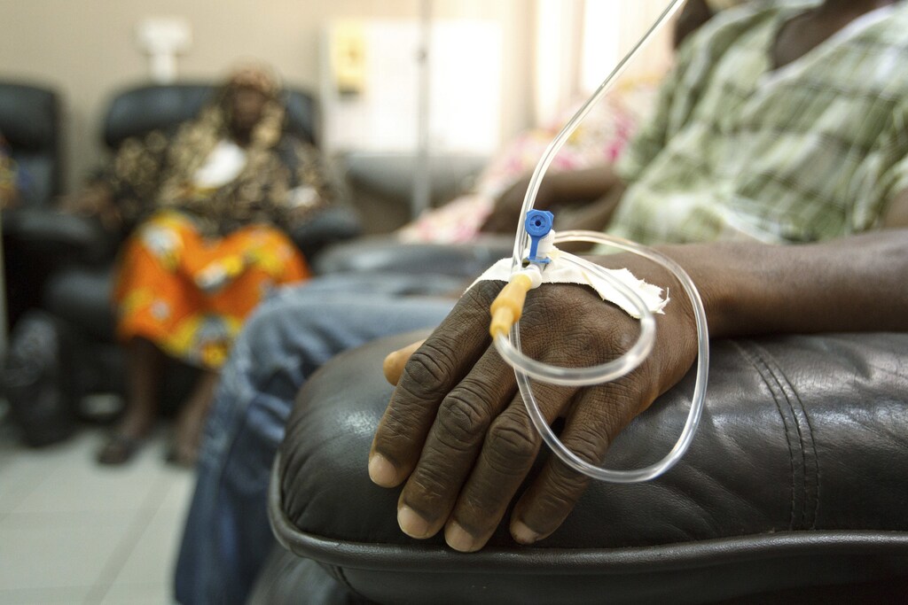 Cancer patients sit in a chemotherapy ward while receiving treatment at the Korle Bu Teaching Hospital in Accra, April 24, 2012. Most of Africa's around 2,000 languages have no word for cancer. The common perception in both developing and developed countries is that it's a disease of the wealthy world, where high-fat, processed-food diets, alcohol, smoking and sedentary lifestyles fuel tumour growth. Yet there are an estimated one million new cancer cases sub-Saharan Africa will see this year - a number predicted to double to 2 million a year in the next decade. Picture taken April 24, 2012. To match Insight CANCER-AFRICA/GHANA REUTERS/Olivier Asselin (GHANA - Tags: HEALTH SOCIETY) - GM1E8511BT401