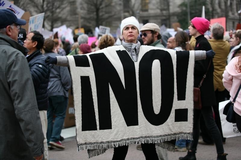 A woman displays a blanket at the Women's March, held in opposition to the agenda and rhetoric of President Donald Trump in Washington, DC, U.S., January 21, 2017. REUTERS/Canice Leung - RC1FD9E42B20