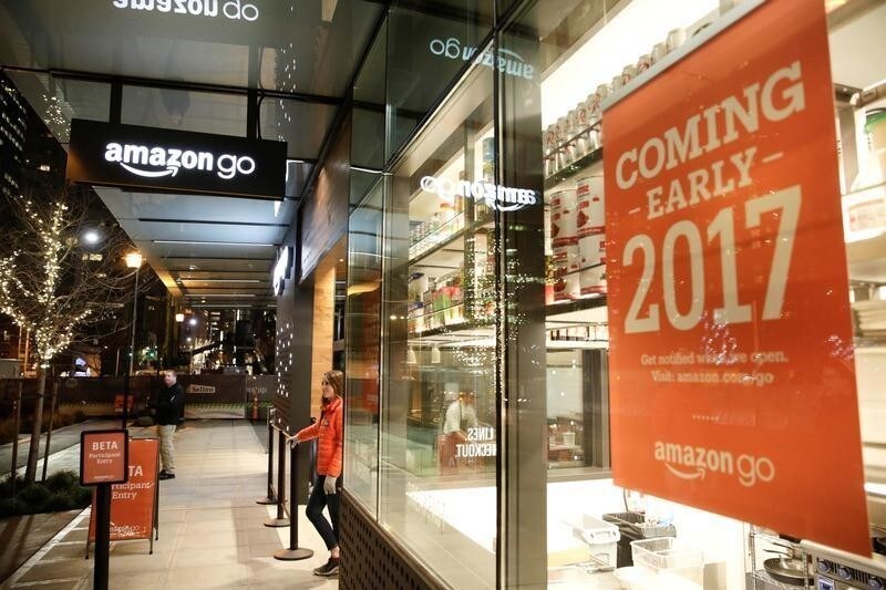 An Amazon employee is pictured outside the Amazon Go brick-and-mortar grocery store without lines or checkout counters, in Seattle Washington, U.S. December 5, 2016. REUTERS/Jason Redmond - RC18A4DB43A0