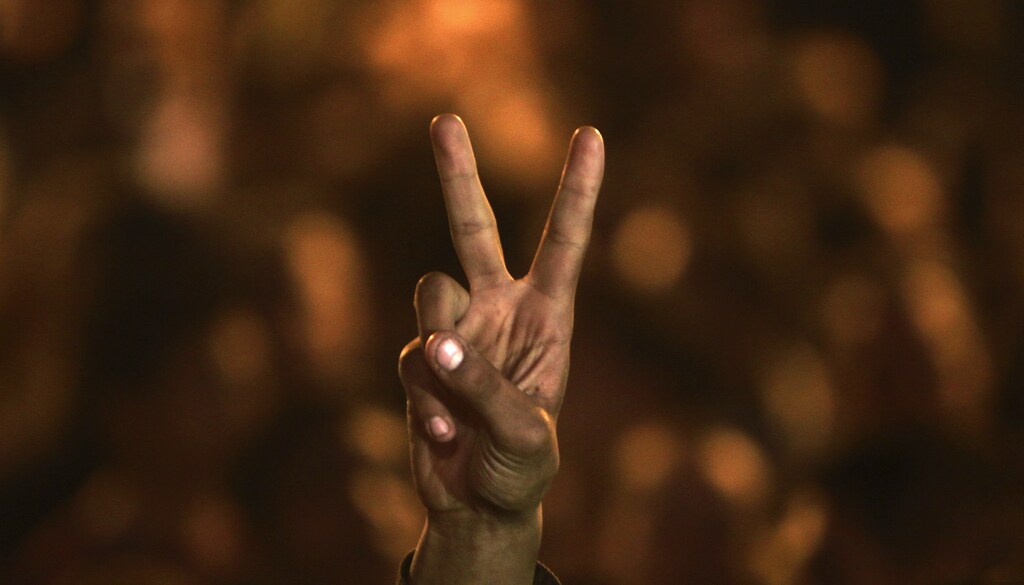 An Egyptian gestures at Tahrir Square, the focal point of the Egyptian uprising, in Cairo January 1, 2012. Egyptians held a ceremony in Cairo?s Tahrir Square to commemorate those killed during and after the uprising that ousted Hosni Mubarak?s regime. REUTERS/Amr Abdallah Dalsh (EGYPT - Tags: POLITICS CIVIL UNREST) - RTR2VS8F