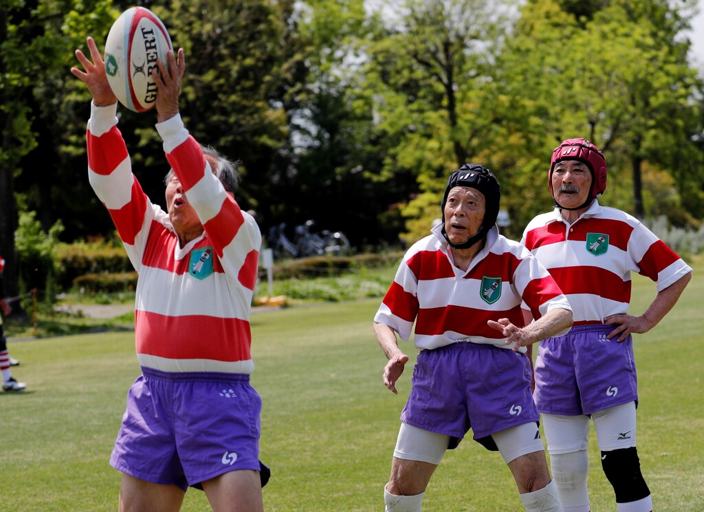 Ryuichi Nagayama (C), 86, Fuwaku Rugby Club's oldest active player, practices before a match in Kumagaya, Saitama Prefecture, Japan, May 3, 2019. "You tackle and battle each other, but the gathering after the play is so enjoyable and fun," said Nagayama. "We talk about how each other plays and no one gets angry about how we played. The atmosphere is great... In short, there is nothing but rugby (for me)." REUTERS/Kim Kyung-Hoon SEARCH "RUGBY VETERANS" FOR THIS STORY. SEARCH "WIDER IMAGE" FOR ALL STORIES. TPX IMAGES OF THE DAY - RC118B8793E0
