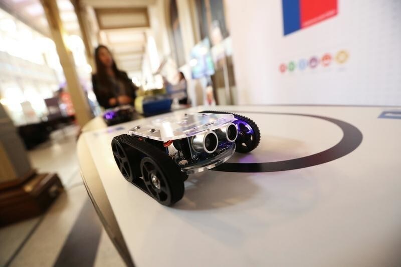 A tiny robot travels along a track during a high school technology fair, in Santiago, Chile, October 24, 2018.