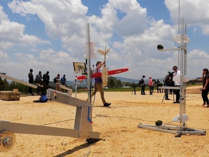Zipline engineer carries a drone at the operation base in Muhanga, south of Rwanda's capital Kigali where Zipline, a California-based robotics company delivered their first blood to patients using a drone October 12, 2016. Picture taken October 12, 2016. REUTERS/James Akena