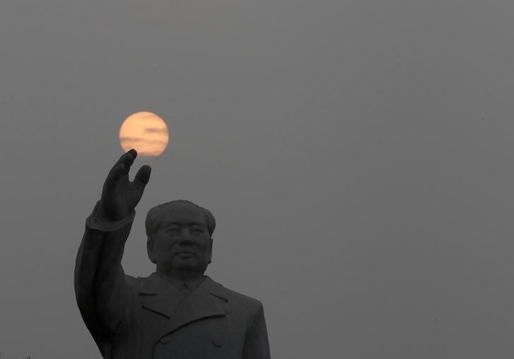 A statue of the late Chairman Mao Zedong at Dong Fang Hong Square in Nanjie village of Luohe city in China's central Henan province September 25, 2012. Nanjie village, with more than 3,100 residents, is touted to be one of the remaining models of communist China, where the principles of morality and collectivism of the late Chairman Mao still strictly guide the people's daily lives. Aside from free housing, healthcare, food rations and education, locals working in the village's factories receive an average salary of 2500 yuan, about 400 dollars. The village's return to communism came at the same time as the rest of the country opened up to the capitalist market in the mid 1980s. Mao is still highly revered in Nanjie, enjoying a god-like status. Picture taken September 25, 2012. REUTERS/Jason Lee (CHINA - Tags: POLITICS SOCIETY TPX IMAGES OF THE DAY)ATTENTION EDITORS: PICTURE 06 OF 33 FOR PACKAGE 'CHINA'S MODEL COMMUNISM'SEARCH 'NANJIE' FOR ALL