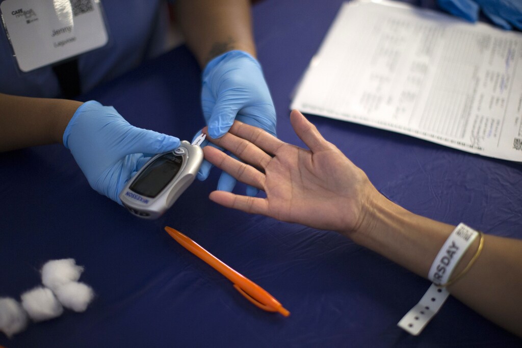 A person receives a test for diabetes.