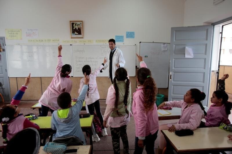 School children listen to a teacher as they study during a class in the Oudaya primary school in Rabat, Morocco January 31, 2019. Picture taken January 31, 2019. REUTERS/Youssef Boudlal - RC1D1246DC00