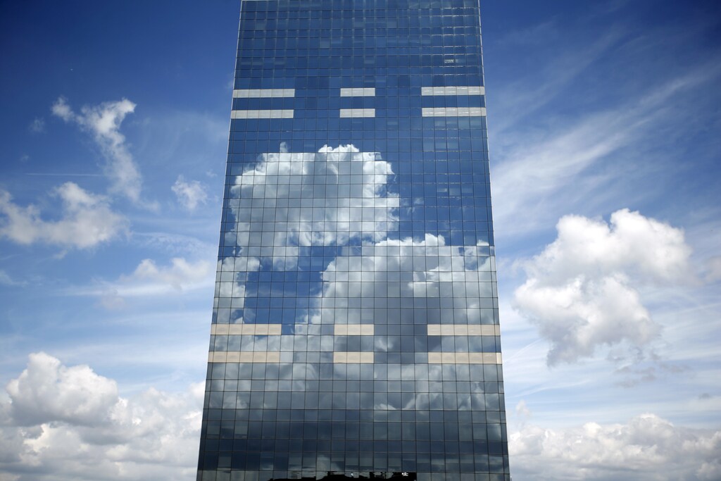 Clouds are reflected in the Midi Tower, the headquarters of the National Pensions Office, in downtown Brussels in Belgium June 21, 2015. Picture taken June 21. REUTERS/Charles Platiau TPX IMAGES OF THE DAY - RTX1HLJY