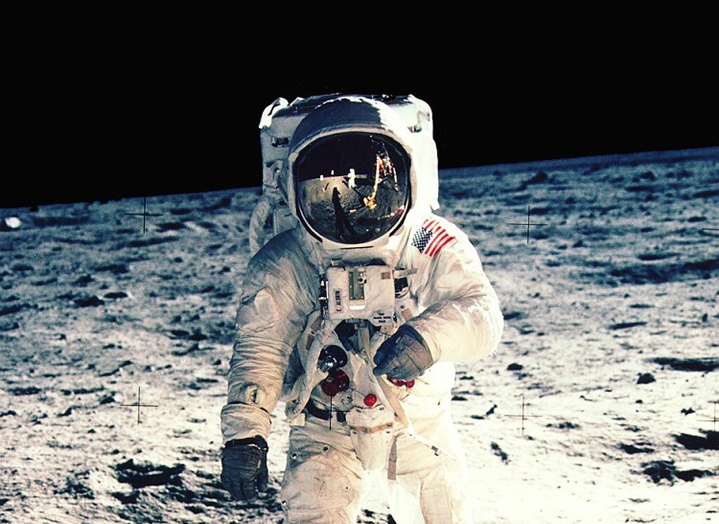 JULY 1969 FILE PHOTO - Astronaut Edwin F. "Buzz" Aldrin Jr., lunar module pilot, faces the camera as he walks on the Moon during Apollo 11 extra vehicular activity in this file photograph. The plexiglass of his helmet reflects back the scene in front of him, such as the Lunar Module and Astronaut Neil Armstrong, taking his picture. Armstrong, Apollo 11 commander, took this photograph with a 70mm lunar surface camera. The 30th anniversary of the Apollo 11 mission is July 16 (launch) and July 20 (landing on the moon).SV/JP