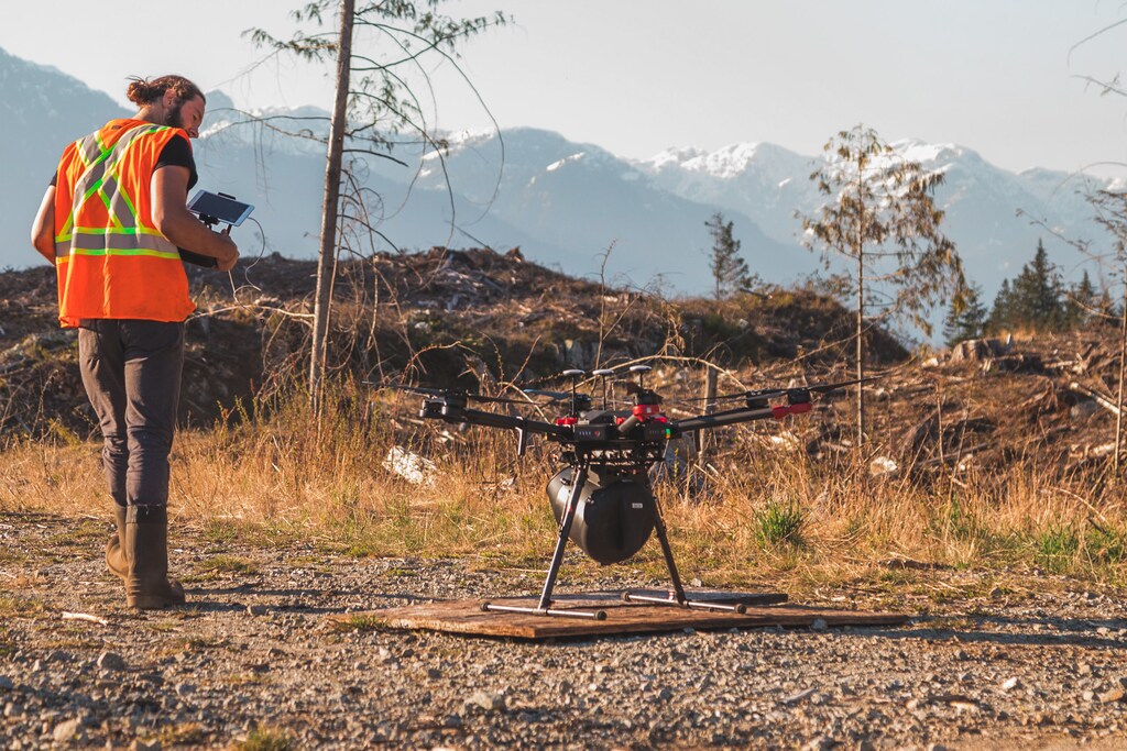 A Flash Forest made tree planting drone sits perched and ready to take off.