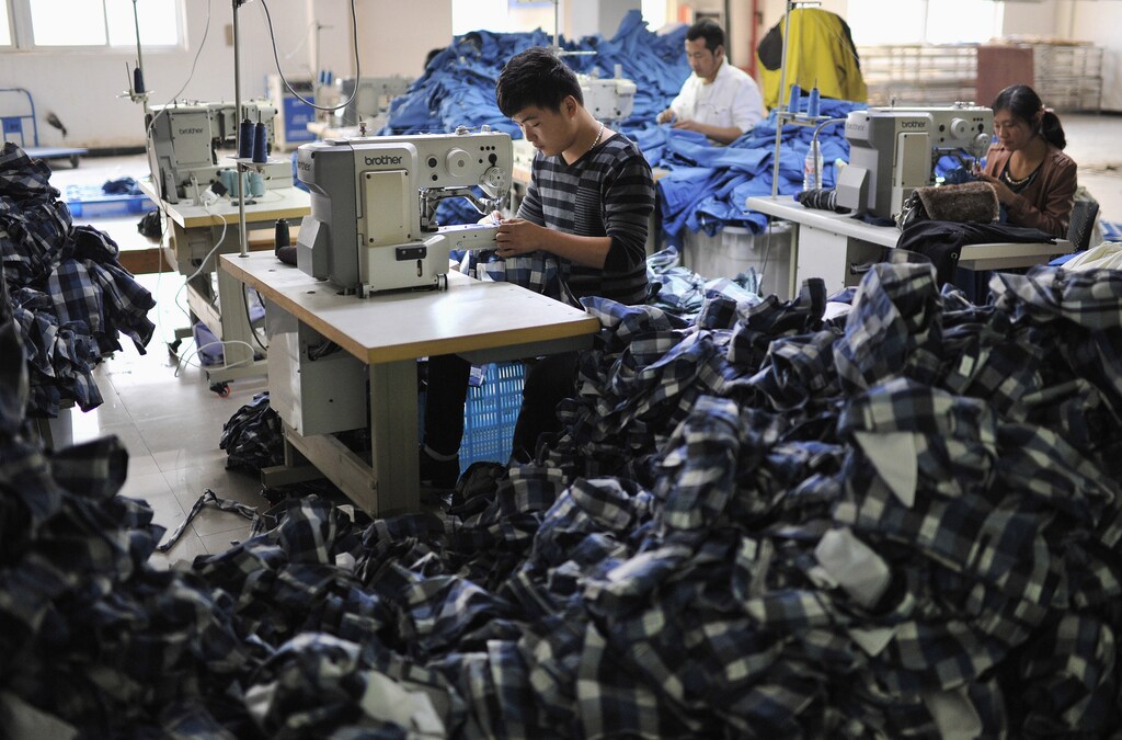 Workers manufacturing clothes for export, in Wuhu, Anhui province, China.