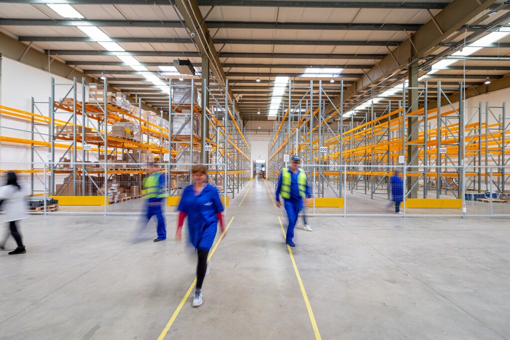 workplaces like this warehouse need personal interaction in order to operate, which was limited during COVID-19