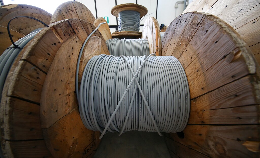 Reels of optical fiber cables are seen in a storage area in Perugia, Italy, June 23, 2017. Picture taken June 23, 2017. REUTERS/Alessandro Bianchi - RC1F54D10110