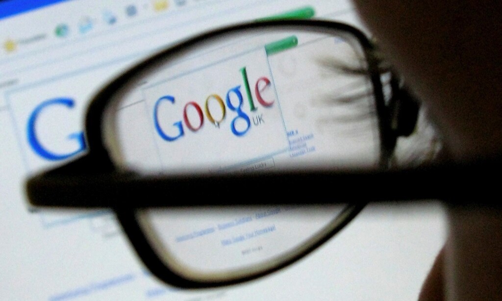 A Google search page is seen through the spectacles of a computer user in Leicester, central England July 20, 2007.