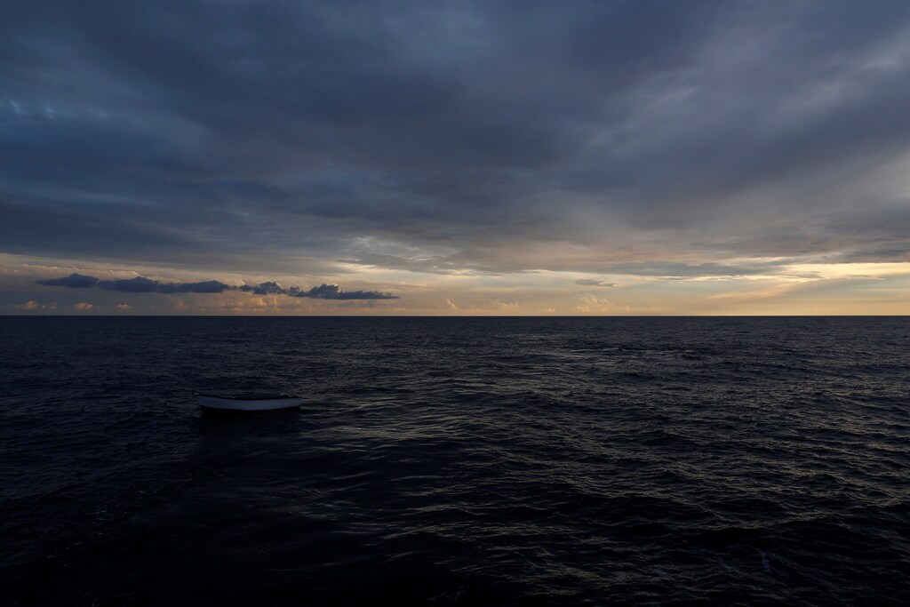 An abandoned fibreglass boat used by migrants is seen from the migrant search and rescue vessel MV Seefuchs of the German NGO Sea-Eye in the search and rescue zone in international waters off the coast of Libya, October 2, 2017. REUTERS/Darrin Zammit Lupi - RC15A0462100