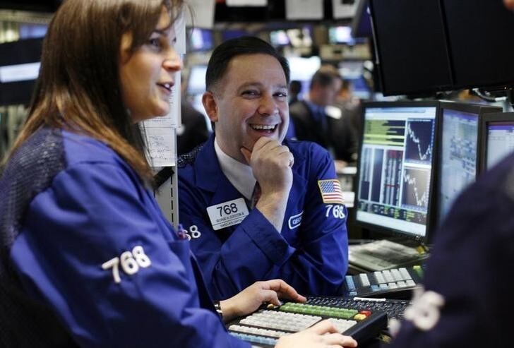 A trader smiles on the floor of the New York Stock Exchange March 23, 2009. U.S. stocks surged around 7 percent on Monday after the Obama administration detailed a plan to purge toxic assets from bank balance sheets, fueling optimism about a revival in bank lending and driving double-digit gains in financial shares. REUTERS/Shannon Stapleton (UNITED STATES BUSINESS)