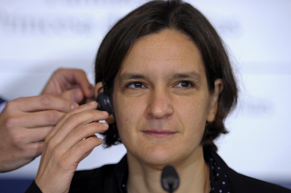 French economist Esther Duflo gets fitted with an earphone before a news conference in Oviedo, October 22, 2015. Duflo will be awarded the 2015 Princess of Asturias Award for Social Sciences at a ceremony on Friday in the Asturian capital. The awards are held annually since 1981 to reward scientific, technical, cultural, social and humanitarian work done by individuals, work teams and institutions.