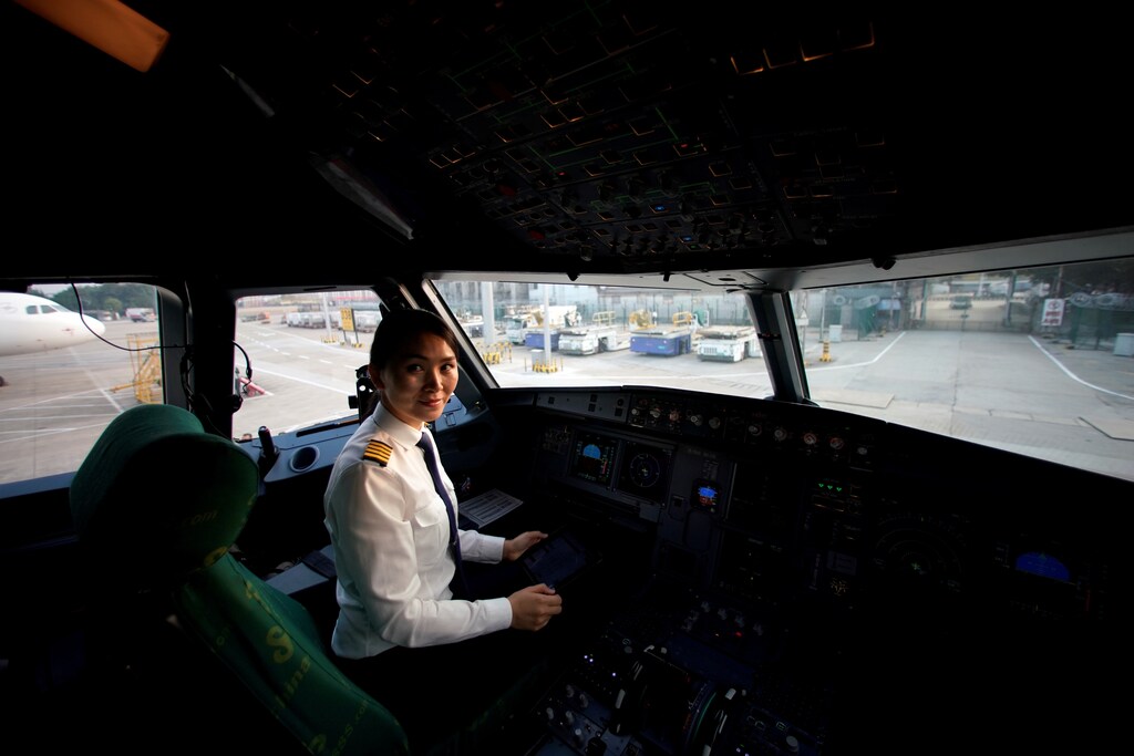 Captain Han Siyuan, 30, poses in the cockpit of Spring Airlines' Airbus A320 before taking off at Hongqiao International Airport in Shanghai, China October 18, 2018. Picture taken October 18, 2018. REUTERS/Aly Song - RC1A3D802E00