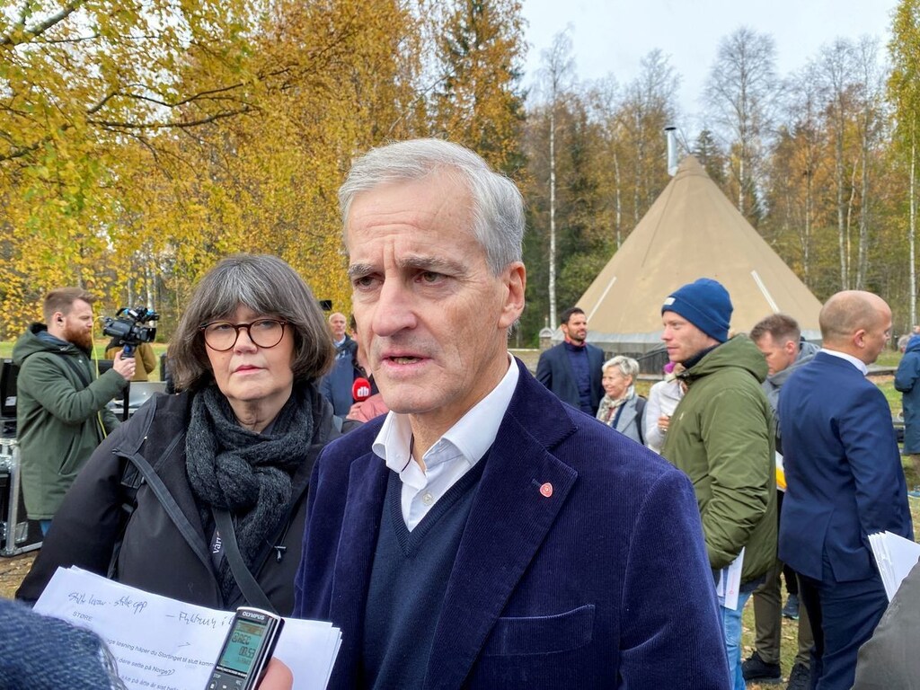 Norway's incoming Prime Minister and Labour leader Jonas Gahr Stoere speaks to a member of the media at a presentation of the incoming government's policies, in Hurdal, Norway