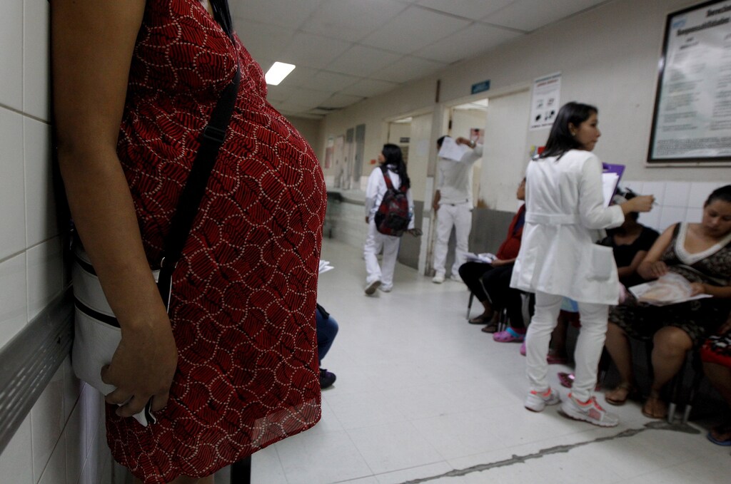 Pregnant woman waits for a routine general checkup, which includes Zika screening, at the maternity ward of the Hospital Escuela in Tegucigalpa, Honduras