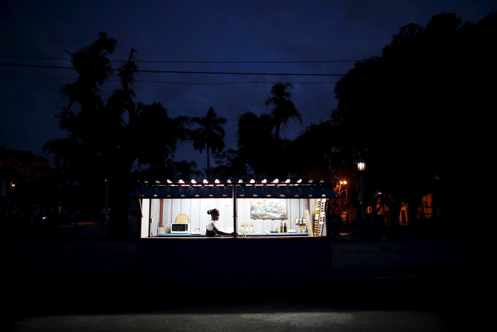 Neilae Bignotle, 23, waits for customers in a small snack shop in Regla, Cuba, March 17, 2016. REUTERS/Alexandre Meneghini - GF10000349820