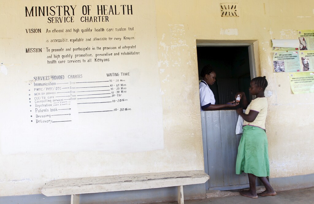 A patient collects medicine at the Kogelo Dispensary in the U.S. President Barack Obama's ancestral village of Nyang'oma Kogelo, west of Kenya's capital Nairobi, July 16, 2015. Obama visits Kenya and Ethiopia in July, his third major trip to Sub-Saharan Africa after travelling to Ghana in 2009 and to Tanzania, Senegal and South Africa in 2011. He has also visited Egypt, in North Africa, and South Africa for Nelson Mandela's funeral. Obama will be welcomed by a continent that had expected closer attention from a man they claim as their son, a sentiment felt acutely in the Kenyan village where the 44th U.S. president's father is buried. Picture taken July 16, 2015. REUTERS/Thomas Mukoya - GF10000168099