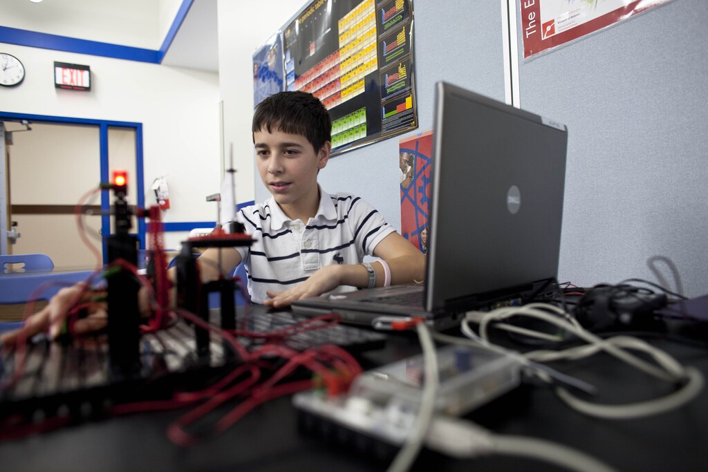 Bryan Molina a 8th grader works on his robot in the bilingual, project lead the way class at Escuela Vieau Middle School in Milwaukee, Wisconsin January 26, 2012