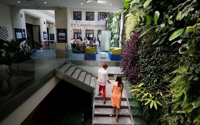 A view shows the working space with a vertical garden at Le Village by CA, a value-creating start-up incubator of banking group Credit Agricole, in Paris, France, July 7, 2017.