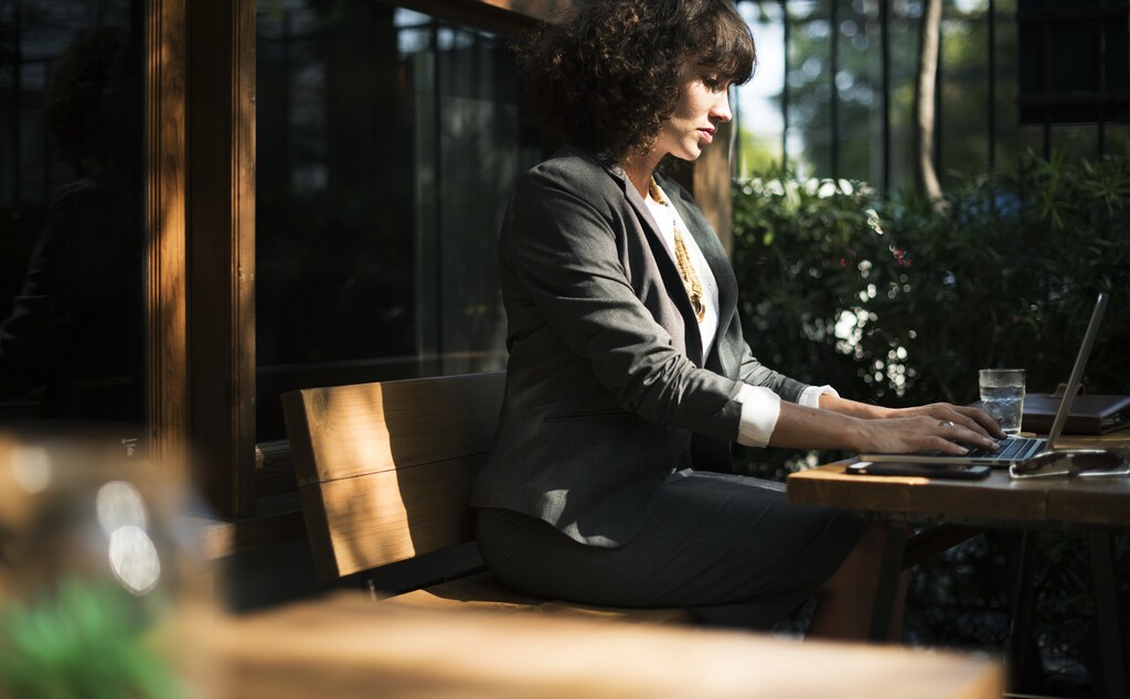 Woman working with laptop at coffee shop