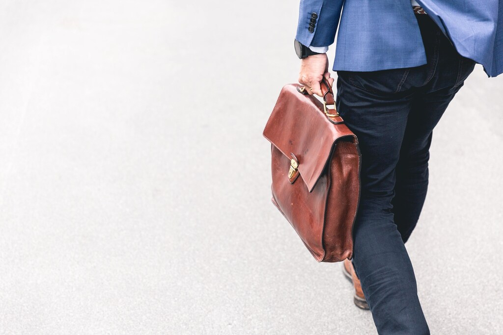 A person holding a briefcase.