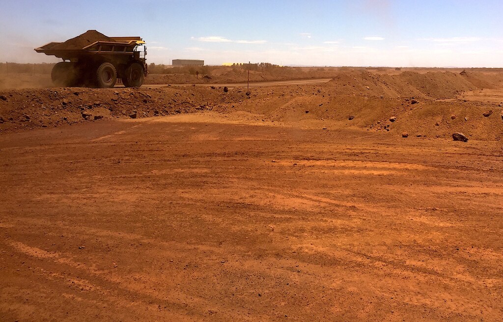 An autonomous vehicle drives along a road as it collects iron ore at Australia's Fortescue Metals Group (FMG) mine in the Pilbara region, located south-east of the coastal town of Port Hedland in Western Australia, November 29, 2018