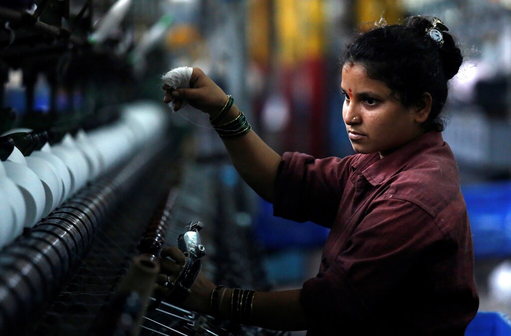 A woman works at a textile mill in Mumbai, India March 8, 2018. REUTERS/Francis Mascarenhas Employees work inside a textile mill of Orient Craft Ltd. at Gurgaon in Haryana, northern India April 16, 2014. When Narendra Modi talks about creating jobs in labour-intensive manufacturing, textile entrepreneur Sudhir Dhingra hopes the Indian opposition leader means business. Dhingra, who employs 30,000 workers in more than 20 factories around the capital New Delhi, says that politicians - for all their promises - have shown no interest in acting to avert a looming employment crisis. Early on, Dhingra survived a change of fashion that saddled him with a pile of unsold stock. Learning his lessons - to keep close tabs on the market and control costs - he built Orient Craft into $250 million business making 200,000 garments daily india women women men female male girls boys teenagers teens development gender gap parity equality diversity progress change feminine masculine woman man sex biology roles dynamic balance bias androgynous