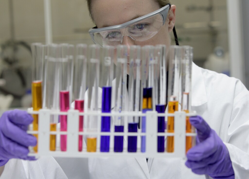 A Santhera employee works with test-tubes in Liestal November 2, 2006. Swiss-based Santhera Pharmaceuticals, which is focusing on developing a number of small-molecule pharmaceutical products for the treatment of severe neuromuscular diseases, will list its shares on the Swiss stock exchange with its first day of trading on November 3. REUTERS/Andreas Meier (SWITZERLAND) - ZM1DTVVQJOAA