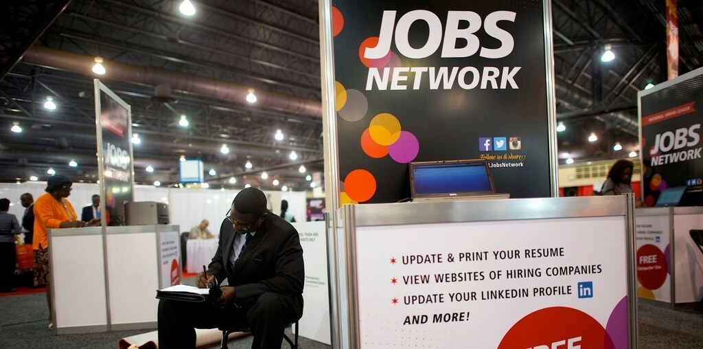 A job-seeker completes an application at a career job fair in Philadelphia, Pennsylvania, U.S