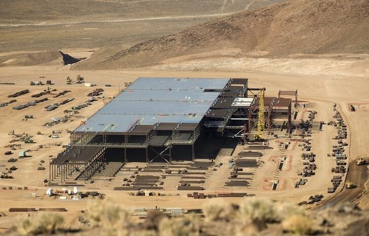 Construction of the Tesla Gigafactory outside Reno, Nevada is shown February 18, 2015. Once known primarily for its casinos and quickie divorces, the Reno area has made impressive strides in its attempt to transform itself into a technology hub in the high-desert of Nevada. In the last few years, it has attracted big Silicon Valley names, including Tesla, Apple and Amazon. But now a new challenge has arisen for Reno: managing its success. Even as the region celebrates its economic wins, it is struggling to cope with the additional demands that the new businesses -- and the new residents they draw -- will place on Reno?s infrastructure, schools, and city services. To match Insight USA-RENO/TECH Picture taken February 18, 2015. REUTERS/James Glover II (UNITED STATES - Tags: TRANSPORT BUSINESS SOCIETY)