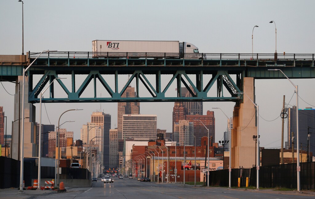 A semi truck headed for Windsor, Ontario, drives on the Ambassador bridge in Detroit, Michigan, U.S., April 26, 2017. REUTERS/Rebecca Cook - RTS147V4